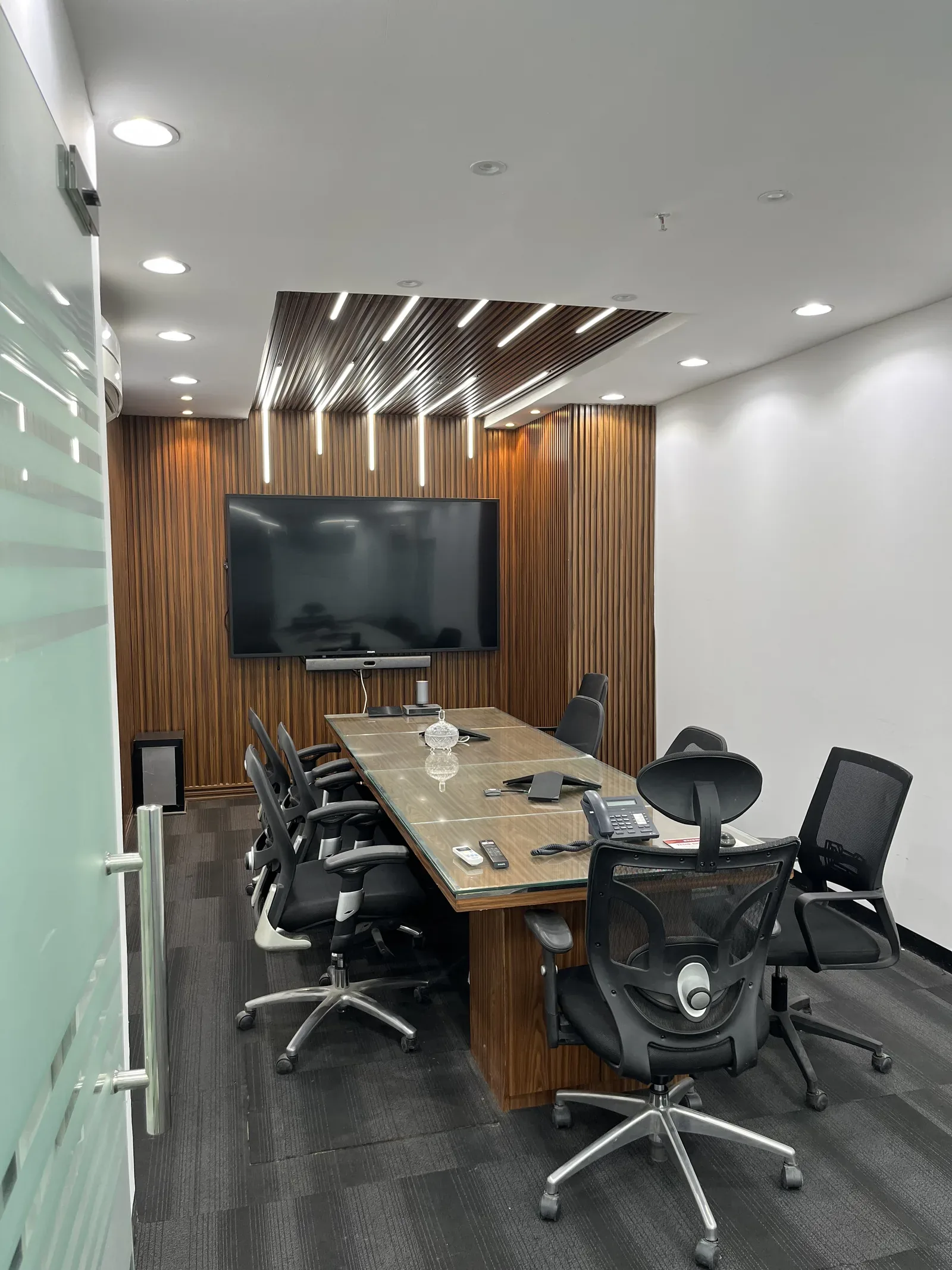 Boardroom at Orfloat Operations Branch with a long glass table and presentation display