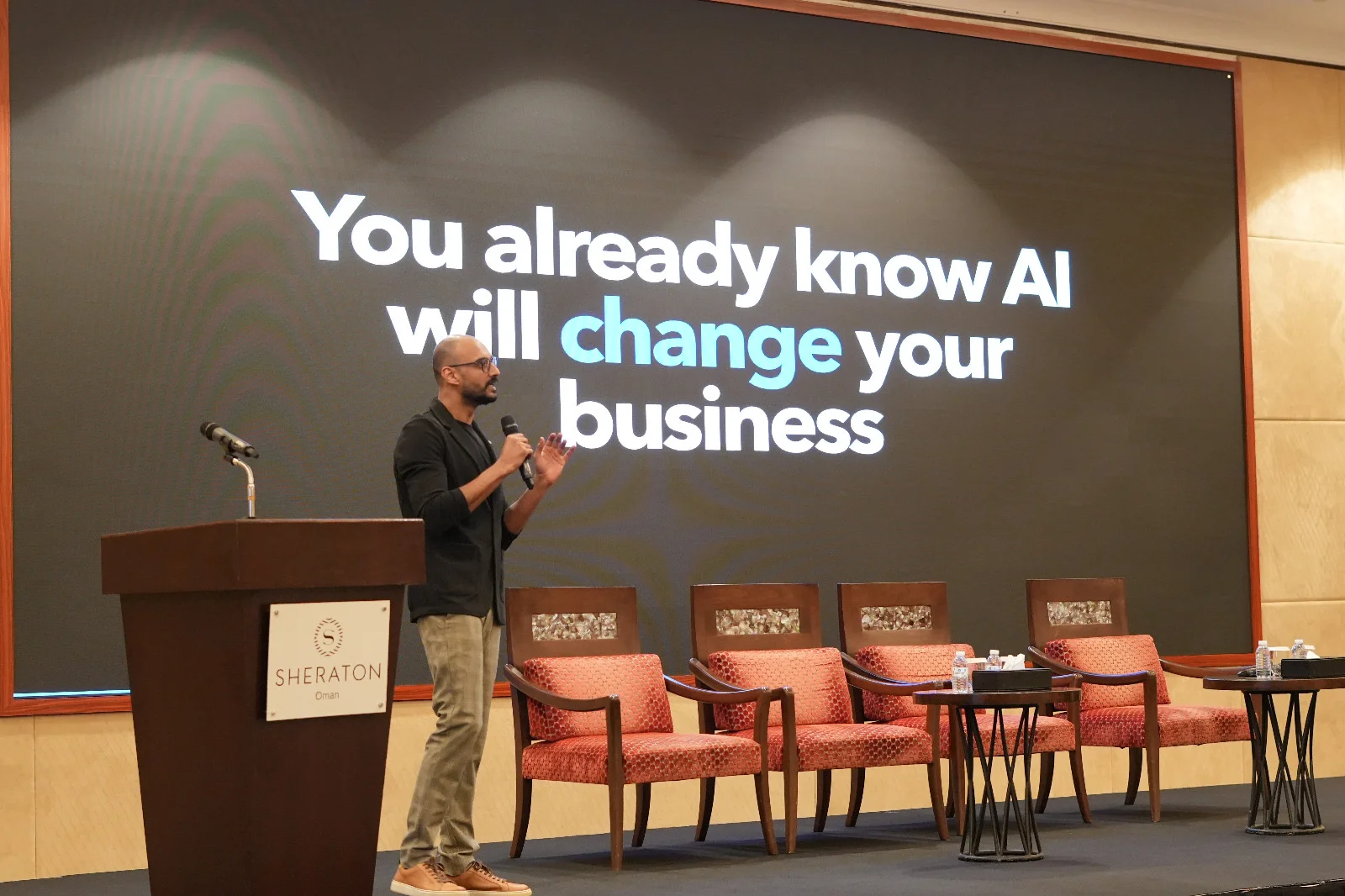 Akram Ahmed speaking about how AI will change business at BCI Business Carnival Season 6 in Muscat