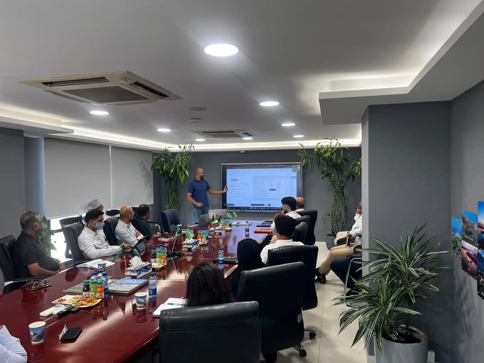 Akram Ahmed presenting a practical AI chat workflow to workshop participants