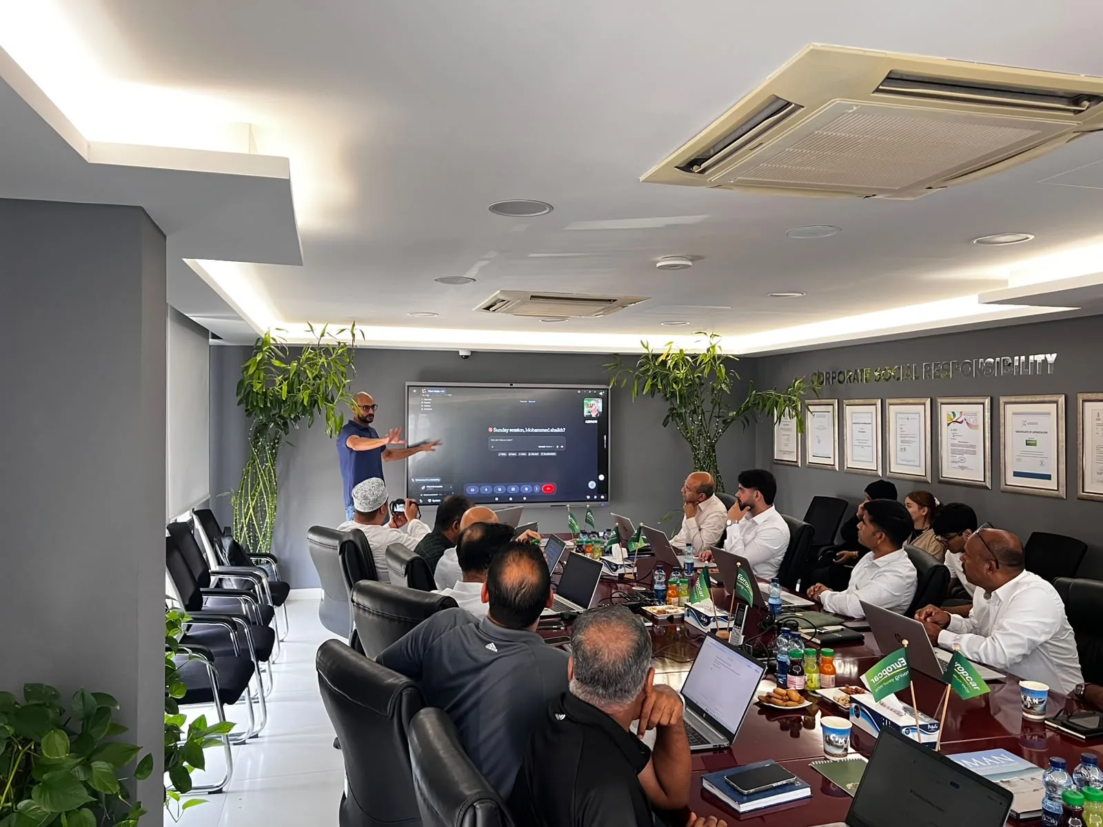 Akram Ahmed leading a live AI session with Europcar Oman staff