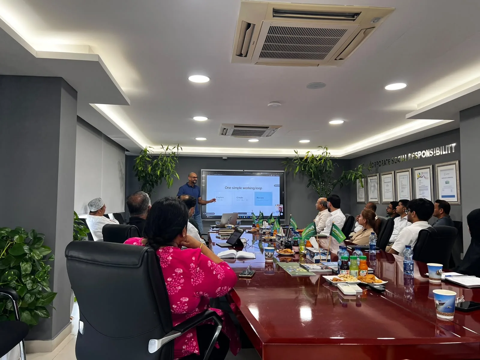 Akram Ahmed presenting to Europcar Oman staff during a technical AI workshop