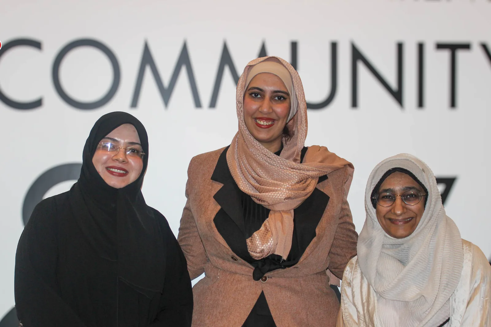 Three participants together at the UAP Oman Chapter event